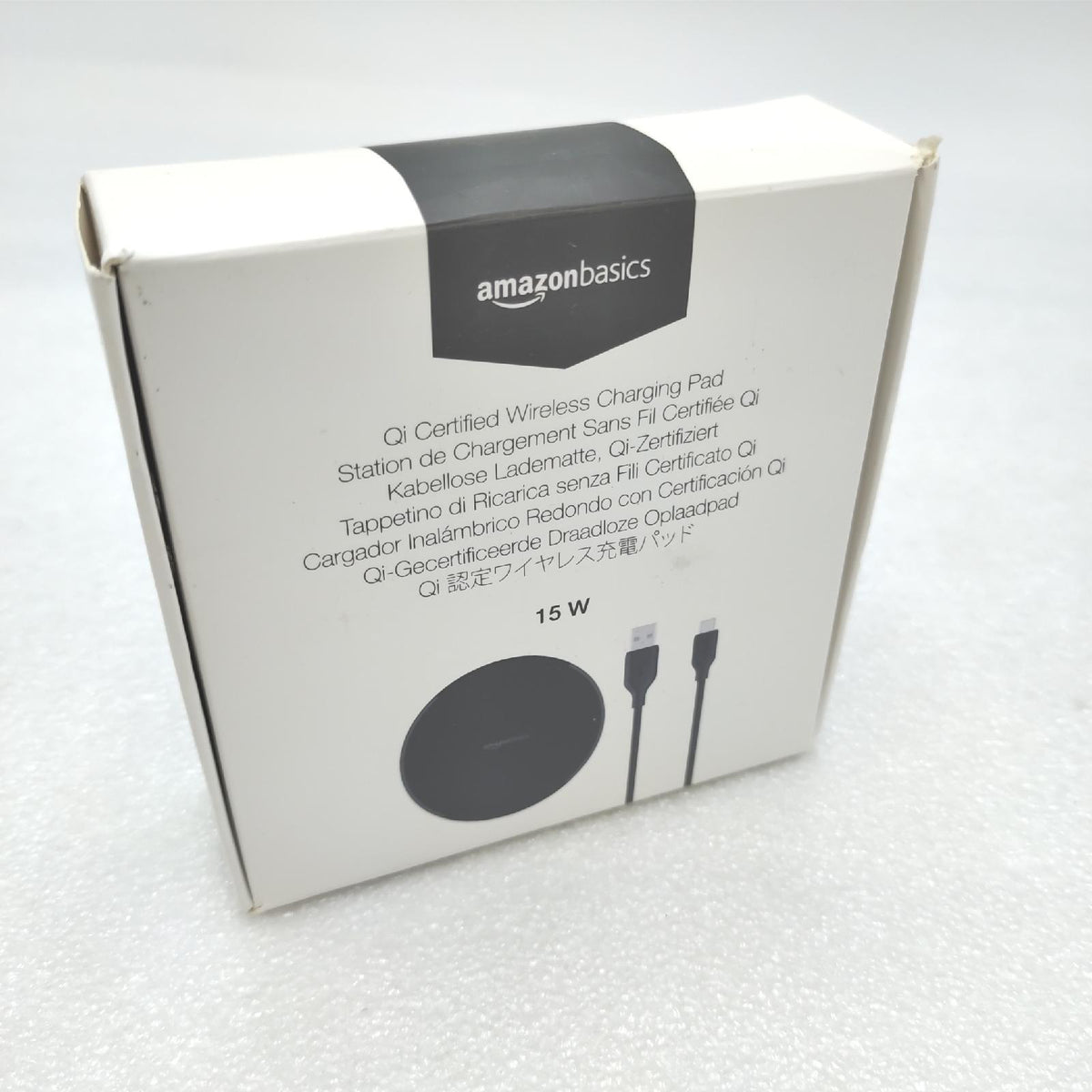 Amazon Basics 15W Qi-zertifiziertes kabelloses Ladepad iPhone 16/15/14/13/12/11/X  Samsung - mit USB-Kabel Netzteil nicht im Lieferumfang enthalten - Schwarz